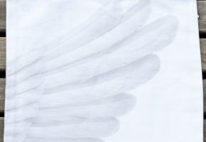 reverse of tote bag with wing image