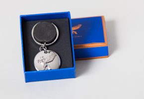 silver plated keyring, with raised pegasus, in display box