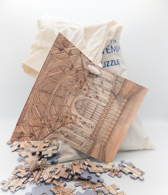 A bag of puzzle pieces and the tag showing the Inner Temple Hall drawing and completed puzzle