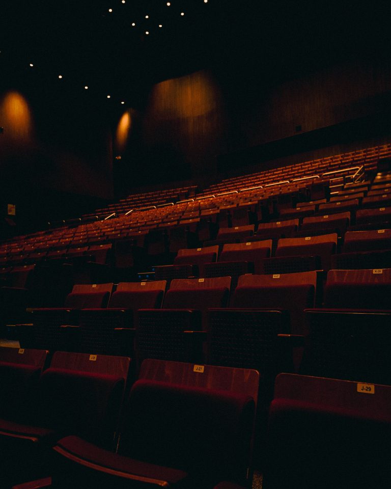Darkly lit red theatre seats