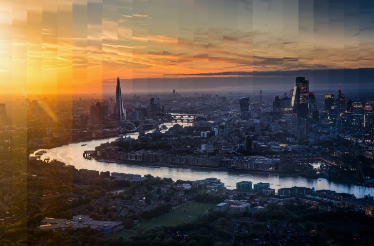 Creative aerial view of London at sunset, blending daytime and evening across the city skyline and River Thames.