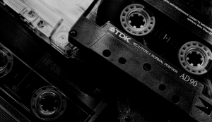 black and white cropped close up of an audio casete from above