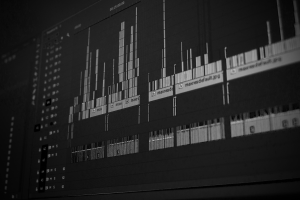 black and white angled shot of an audio waveform on a computer screen